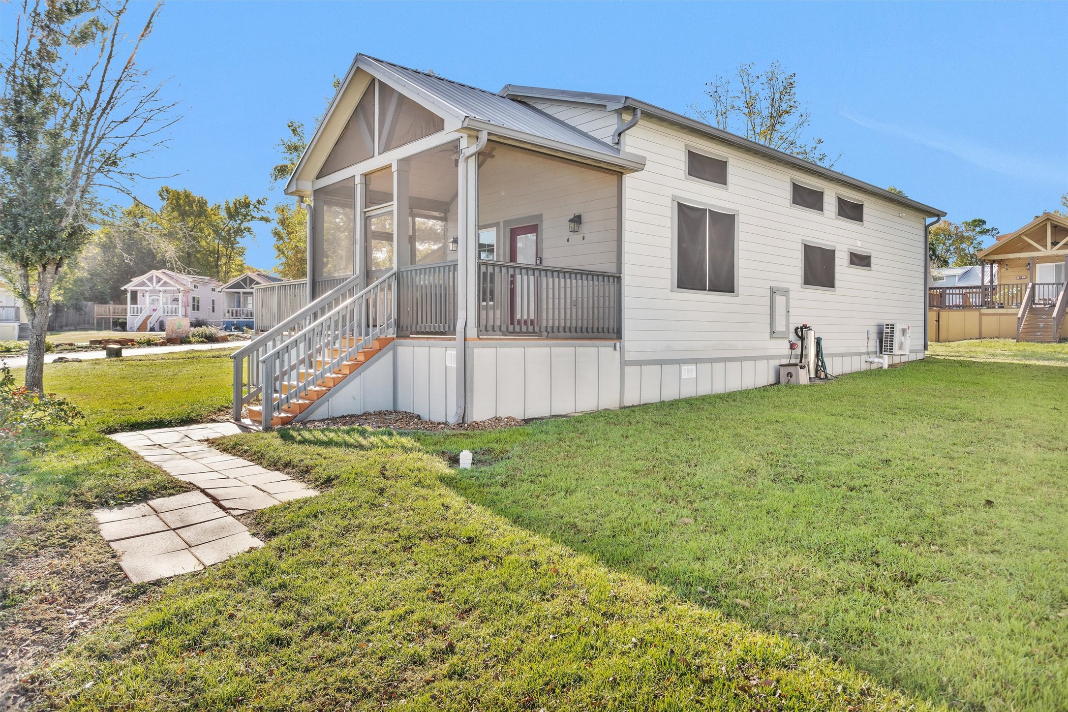 12922 Longstreet Road, Unit 711 Willis, TX 77318 - Photo 2 of 29 a view of a house with backyard and sitting area