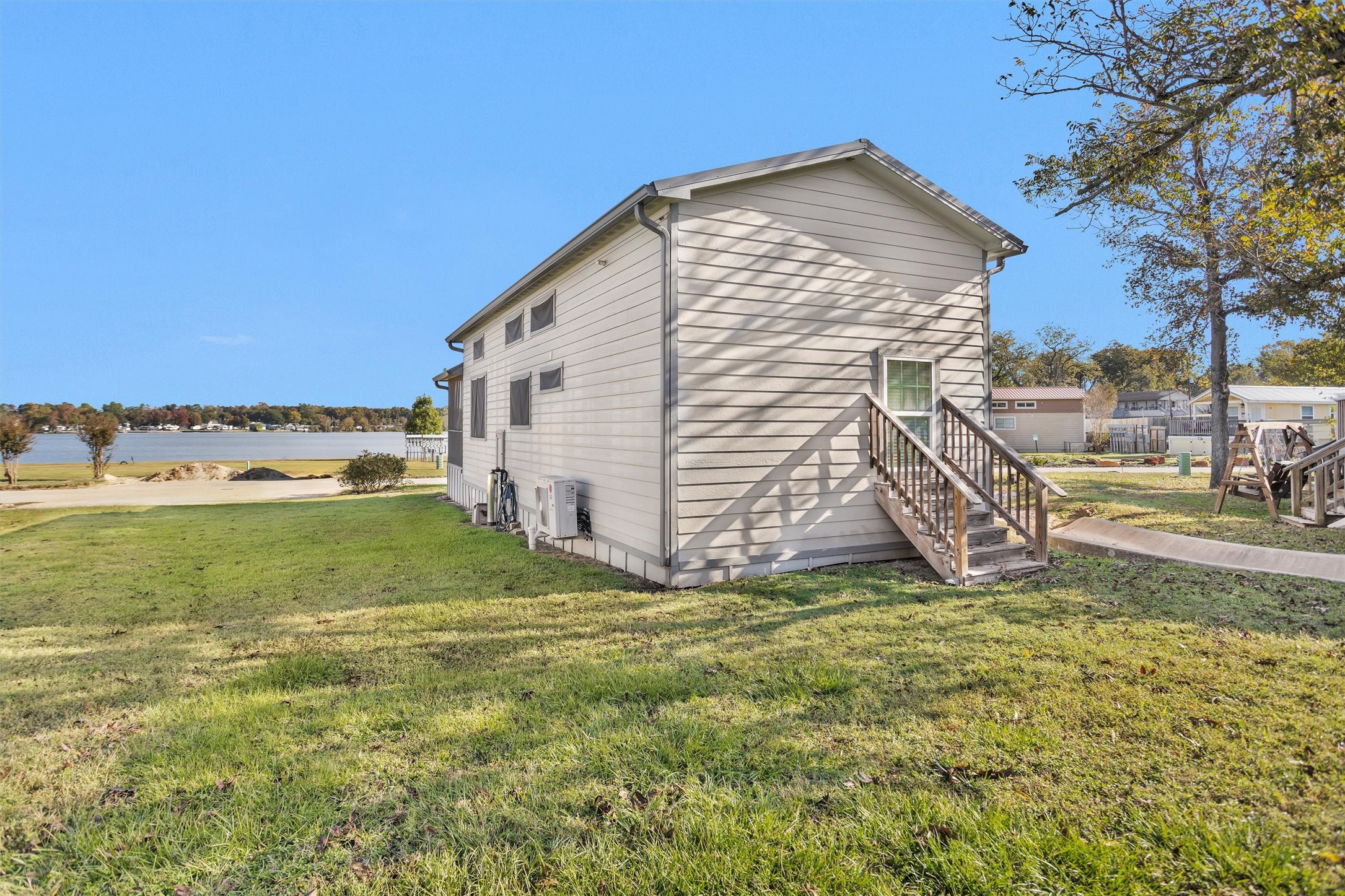 12922 Longstreet Road, Unit 711 Willis, TX 77318 - Photo 22 of 29 a view of a house with a yard