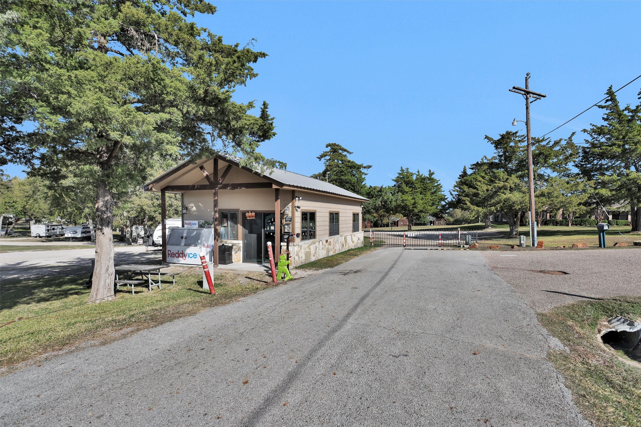 12922 Longstreet Road, Unit 711 Willis, TX 77318 - Photo 24 of 29 a front view of a house with garden