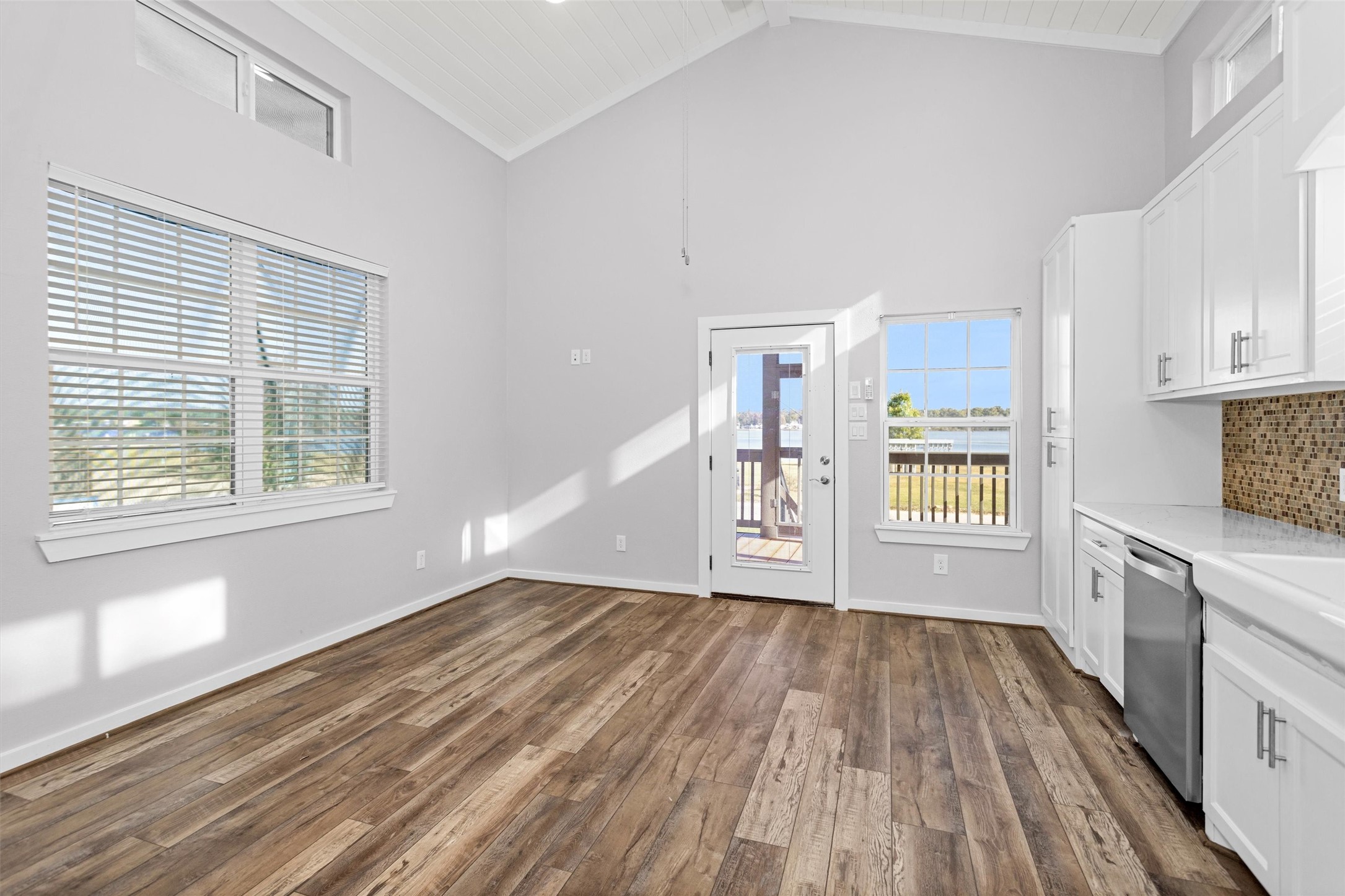 12922 Longstreet Road, Unit 711 Willis, TX 77318 - Photo 6 of 29 a view of an empty room with a window and wooden floor