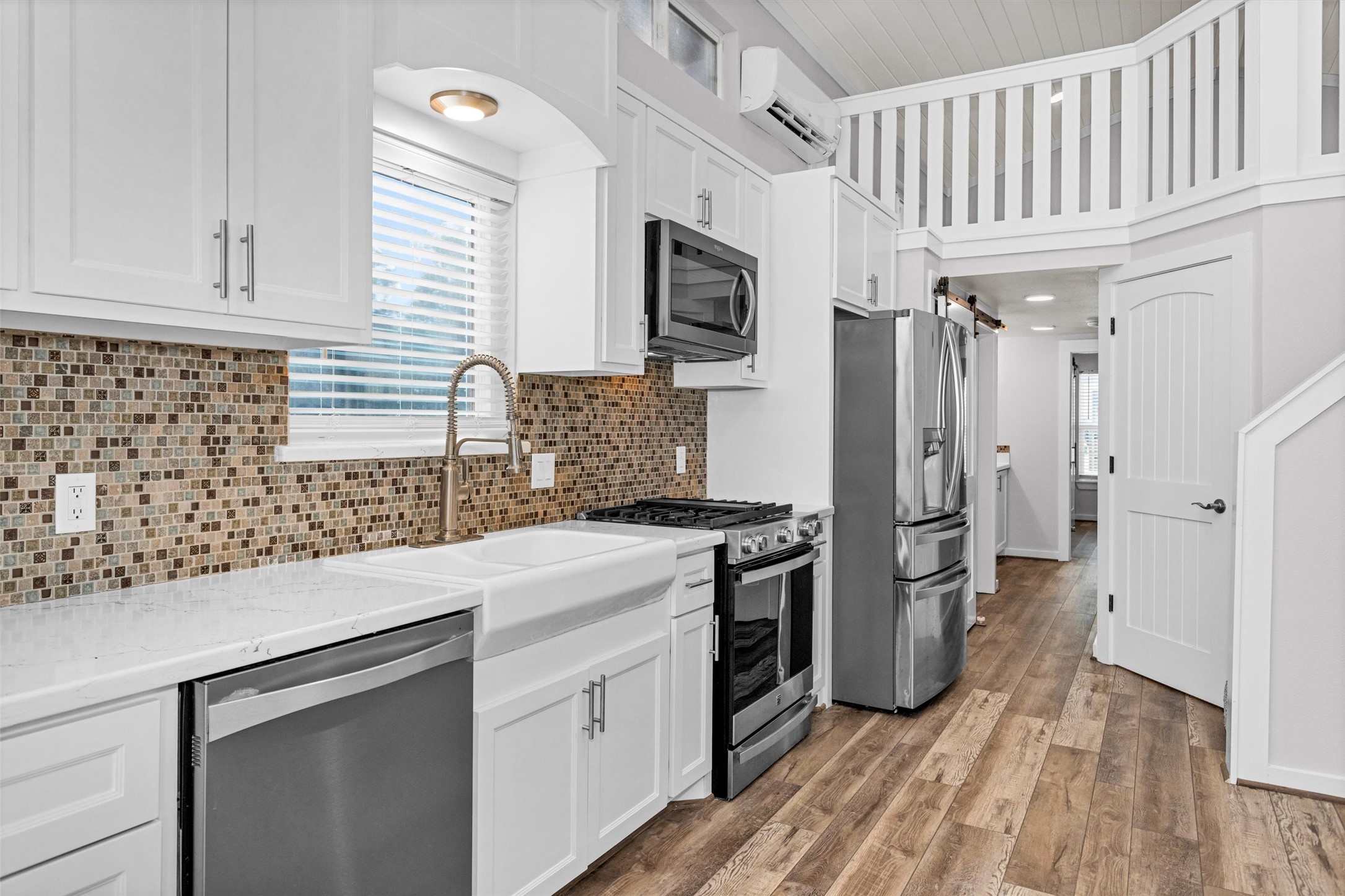 12922 Longstreet Road, Unit 711 Willis, TX 77318 - Photo 8 of 29 a kitchen with a sink appliances and cabinets