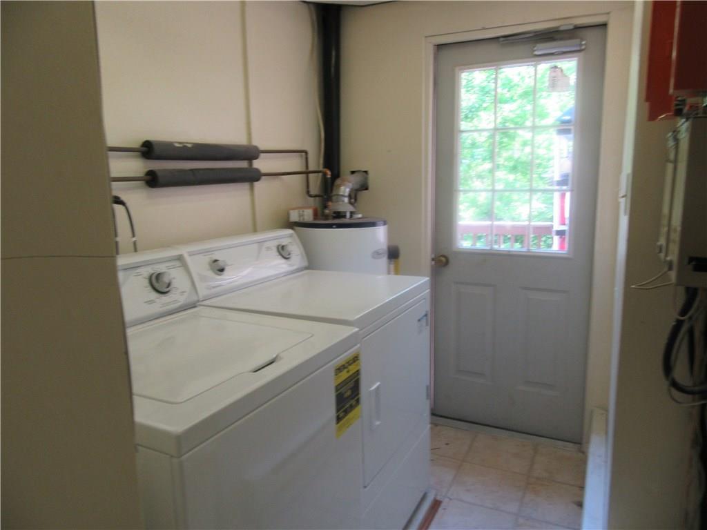 420 Manor Harrison City Road Manor, PA 15665 - Photo 2 of 25 Laundry with newer washer and dryer. Room is accessable from upper and lower levels