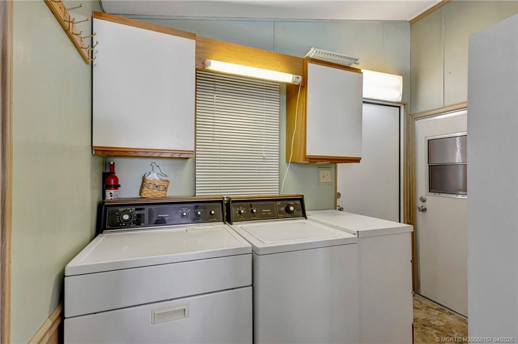 10725 South Ocean Drive, Unit 437 Jensen Beach, FL 34957 - Photo 18 of 32 a utility room with dryer and washer