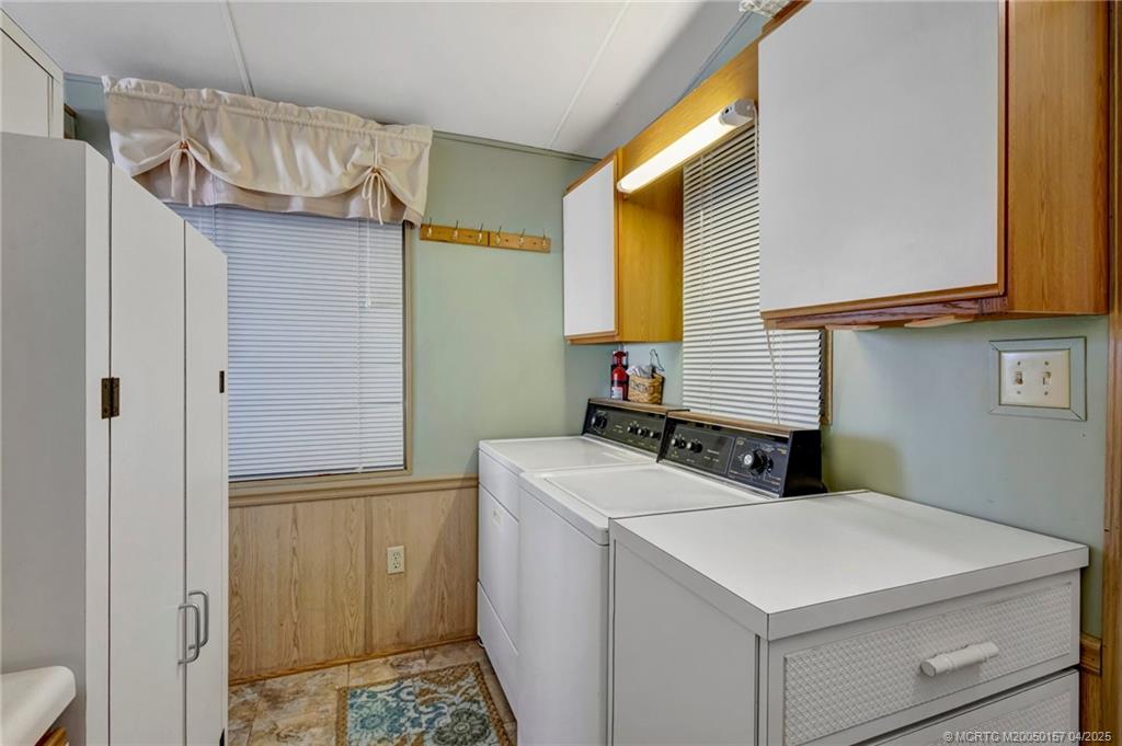 10725 South Ocean Drive, Unit 437 Jensen Beach, FL 34957 - Photo 19 of 32 a utility room with dryer and washer