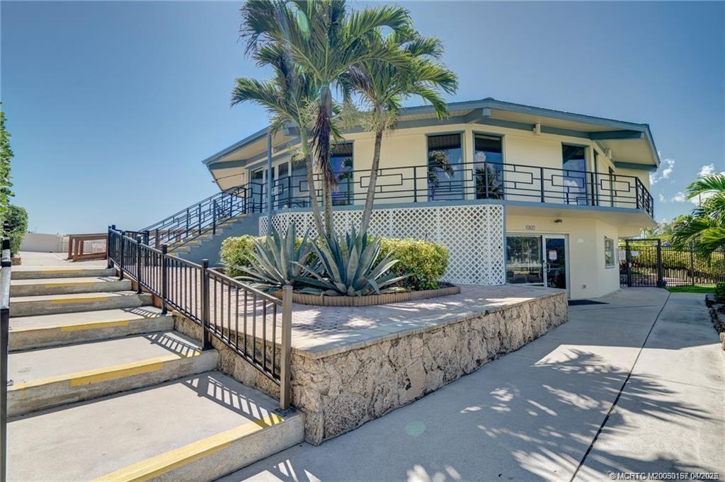 10725 South Ocean Drive, Unit 437 Jensen Beach, FL 34957 - Photo 28 of 32 a view of a house with a yard