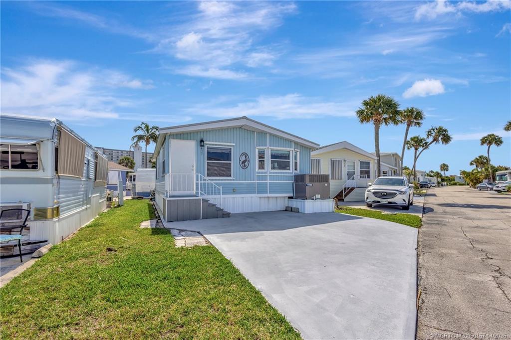 10725 South Ocean Drive, Unit 437 Jensen Beach, FL 34957 - Photo 3 of 32 a view of house with outdoor space and entertaining space