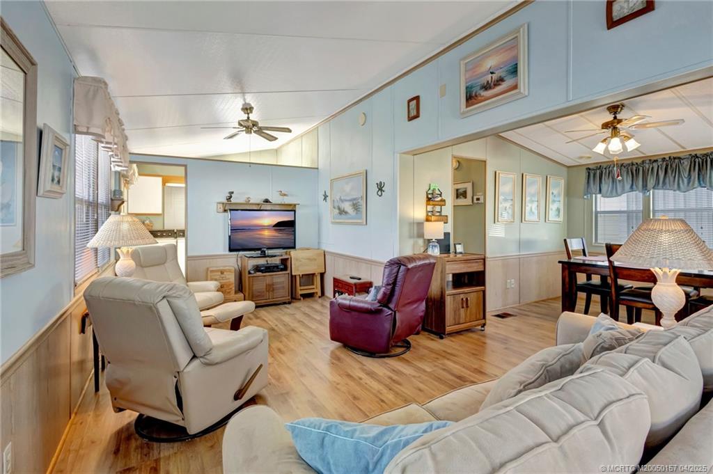 10725 South Ocean Drive, Unit 437 Jensen Beach, FL 34957 - Photo 7 of 32 a living room with furniture fireplace and a table