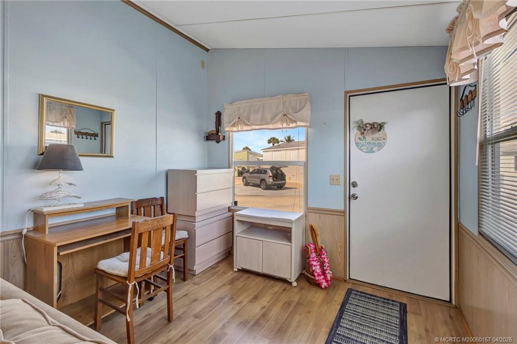 10725 South Ocean Drive, Unit 437 Jensen Beach, FL 34957 - Photo 8 of 32 a kitchen with stainless steel appliances a stove a refrigerator and cabinets