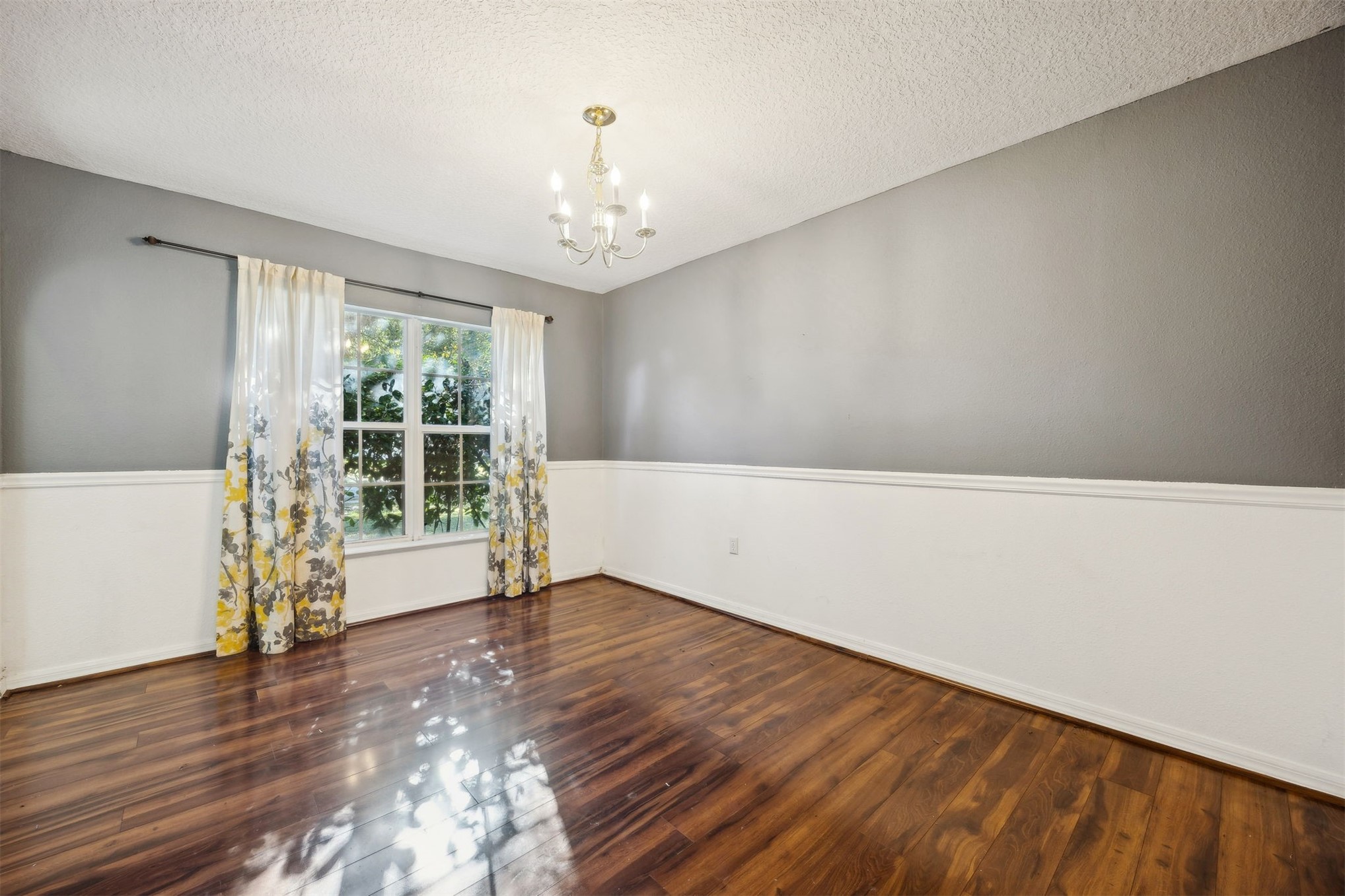 87233 Kipling Drive Yulee, FL 32097 - Photo 14 of 38 wooden floor in an empty room with a window