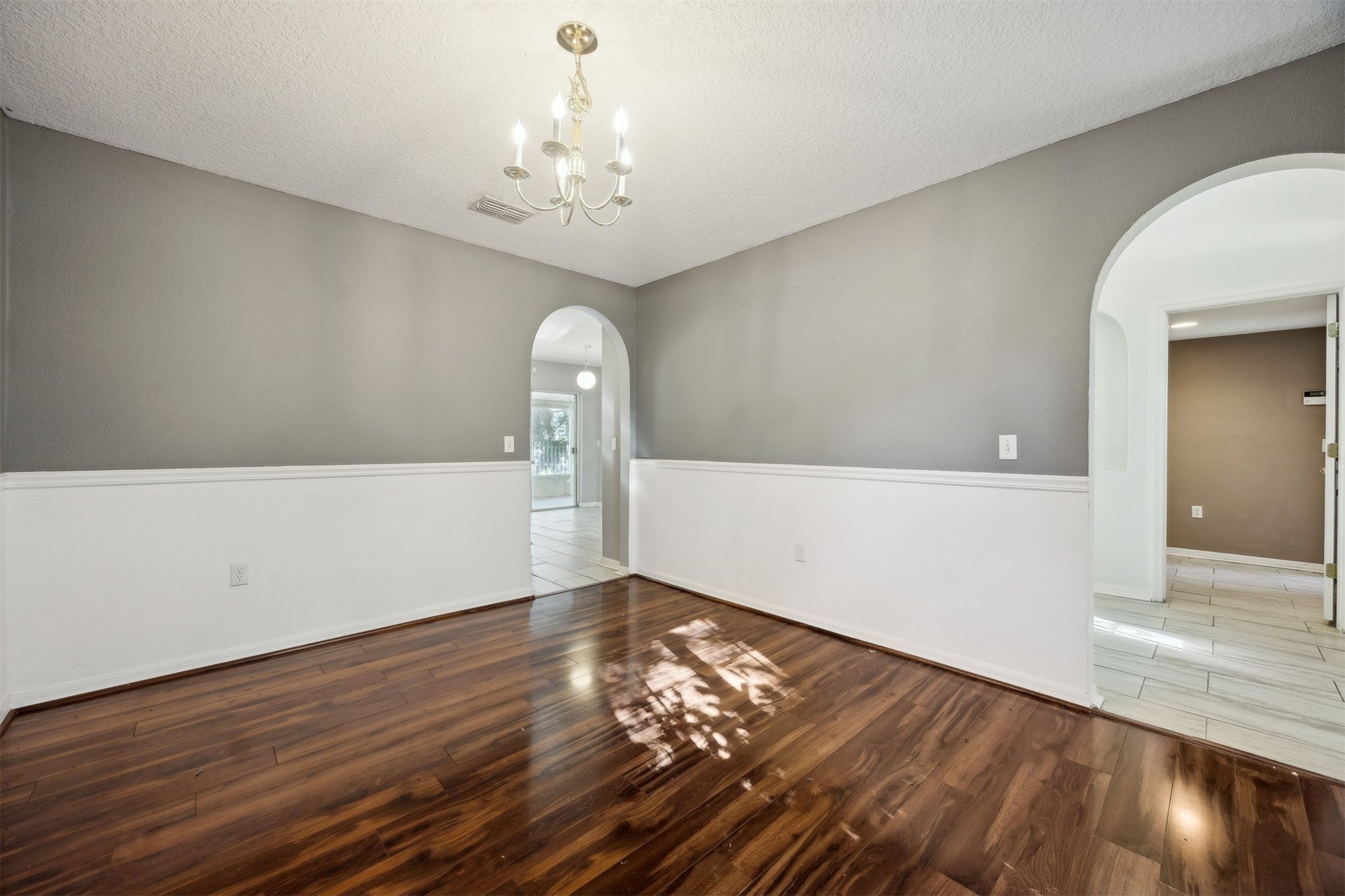 87233 Kipling Drive Yulee, FL 32097 - Photo 15 of 38 a view of empty room with wooden floor