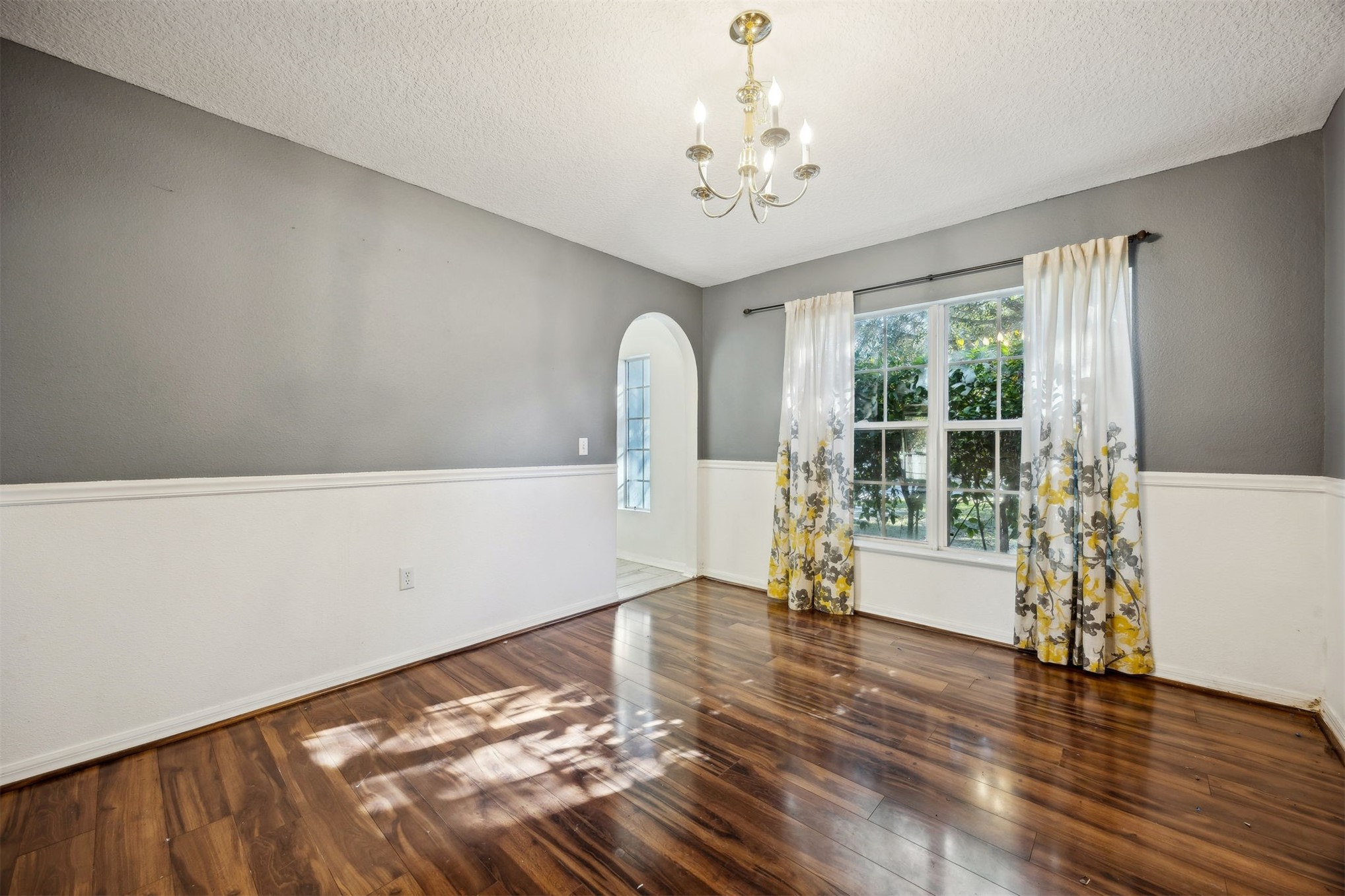 87233 Kipling Drive Yulee, FL 32097 - Photo 16 of 38 a view of an empty room with wooden floor and a window