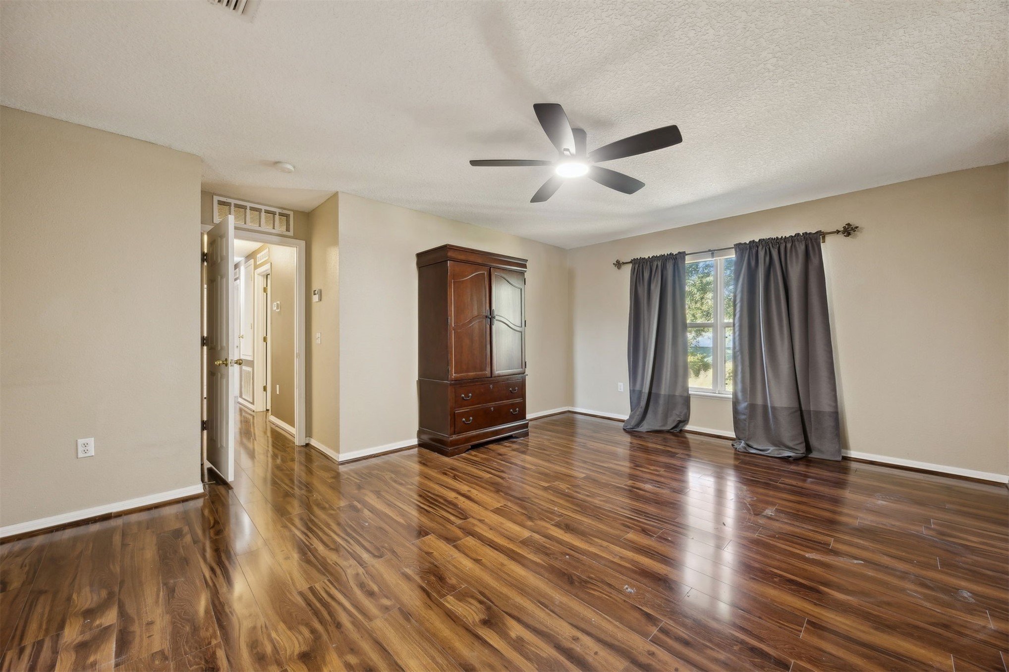 87233 Kipling Drive Yulee, FL 32097 - Photo 24 of 38 an empty room with wooden floor and windows
