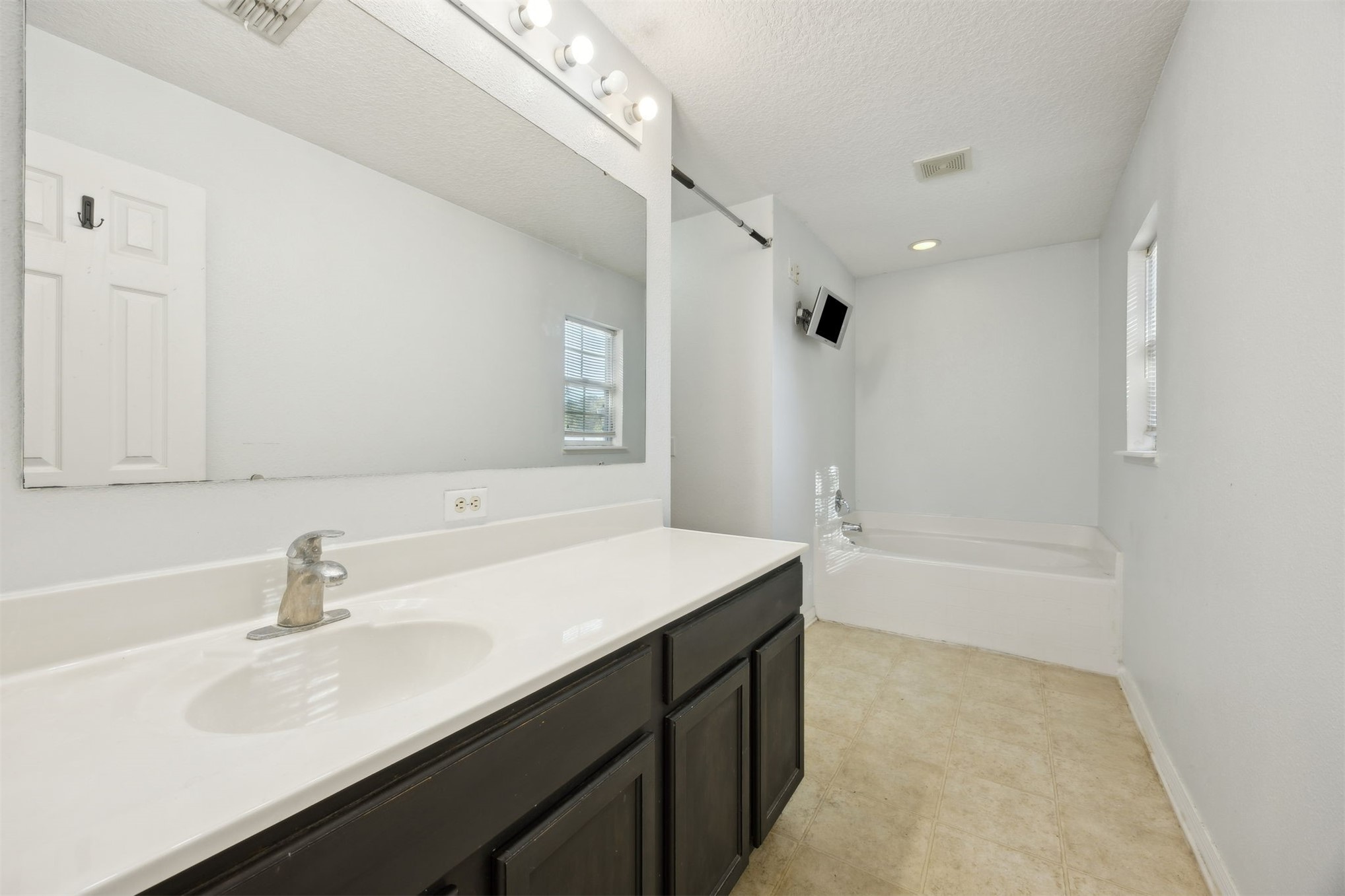 87233 Kipling Drive Yulee, FL 32097 - Photo 26 of 38 a bathroom with a sink double vanity granite tub shower and a mirror