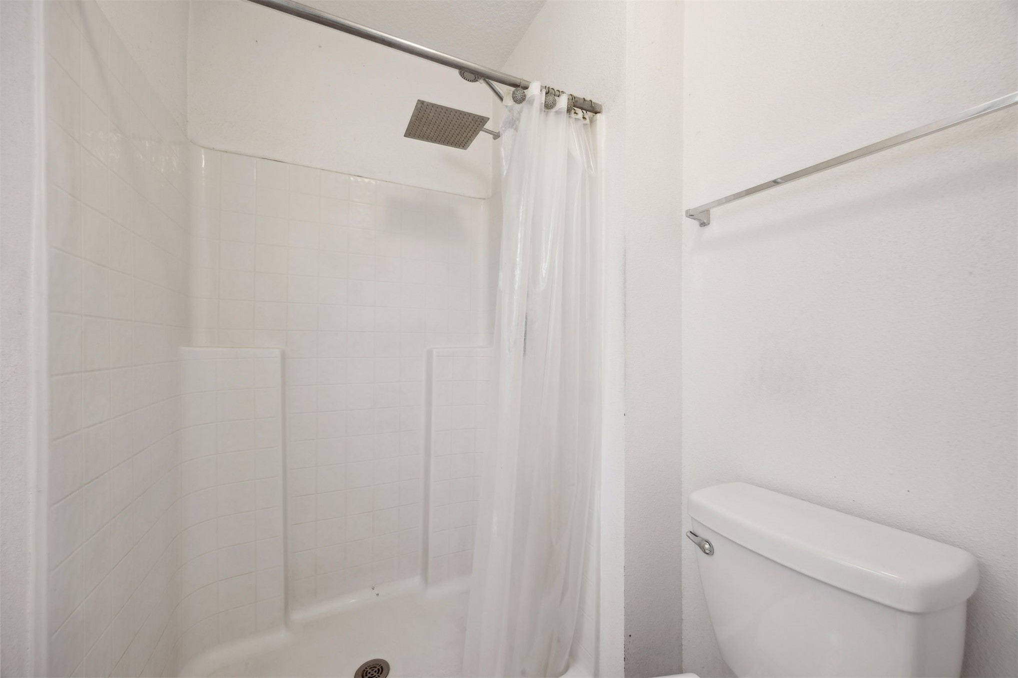 87233 Kipling Drive Yulee, FL 32097 - Photo 27 of 38 a bathroom with a shower curtain and toilet