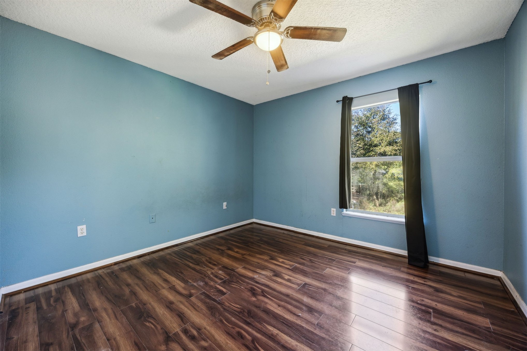 87233 Kipling Drive Yulee, FL 32097 - Photo 29 of 38 wooden floor in an empty room with a window
