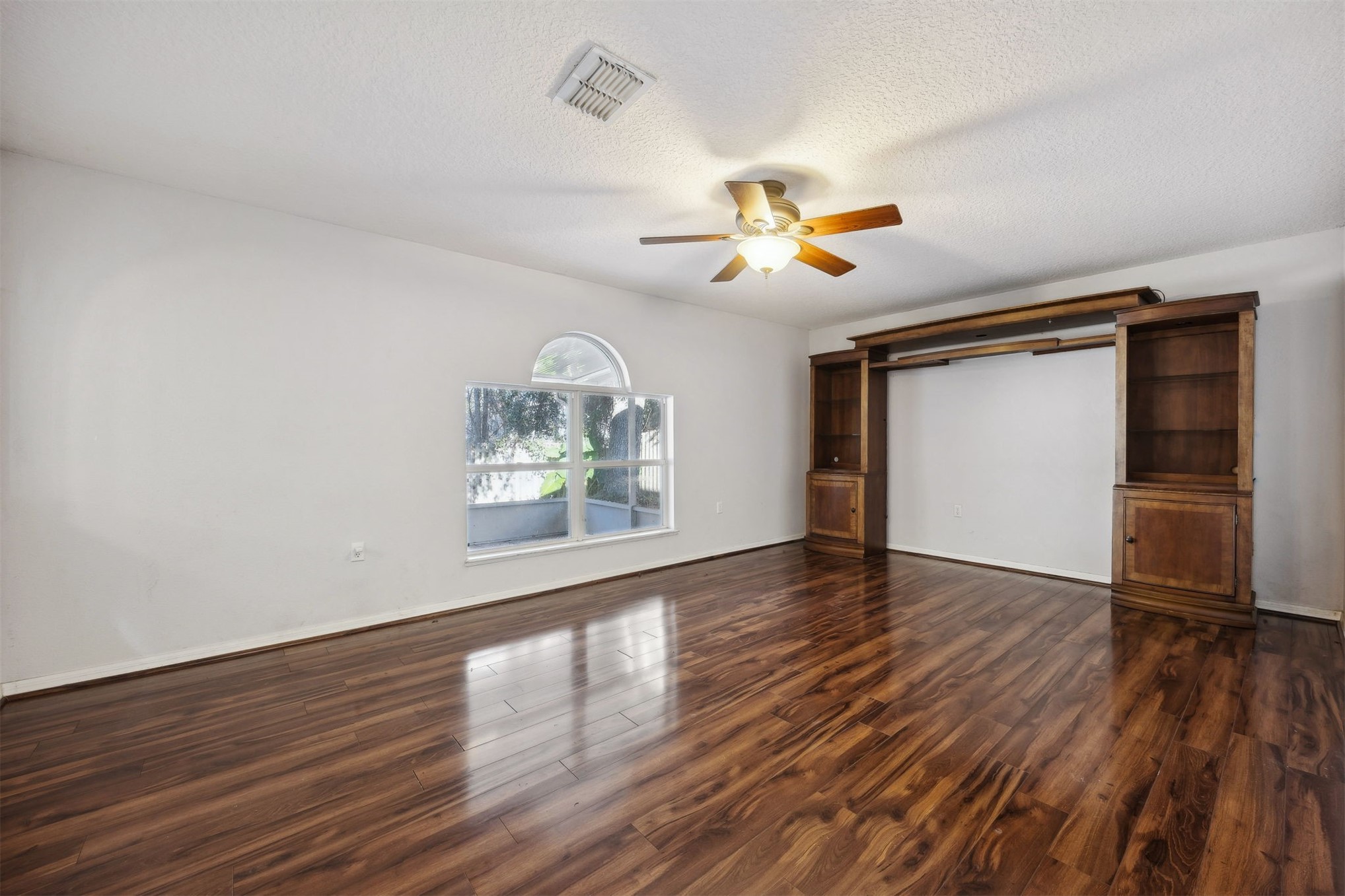87233 Kipling Drive Yulee, FL 32097 - Photo 3 of 38 wooden floor in an empty room with a window
