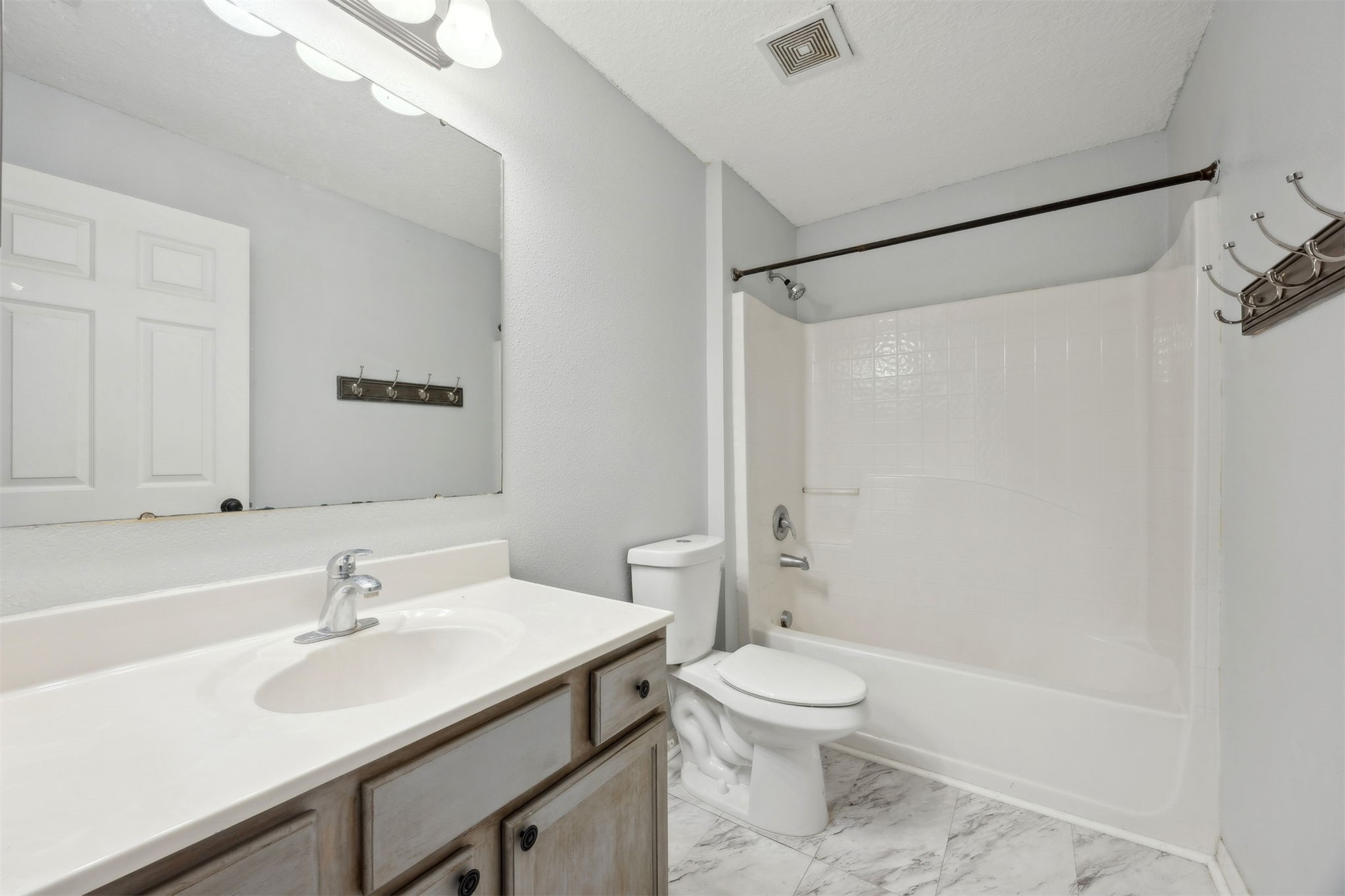 87233 Kipling Drive Yulee, FL 32097 - Photo 31 of 38 a bathroom with a sink toilet and shower
