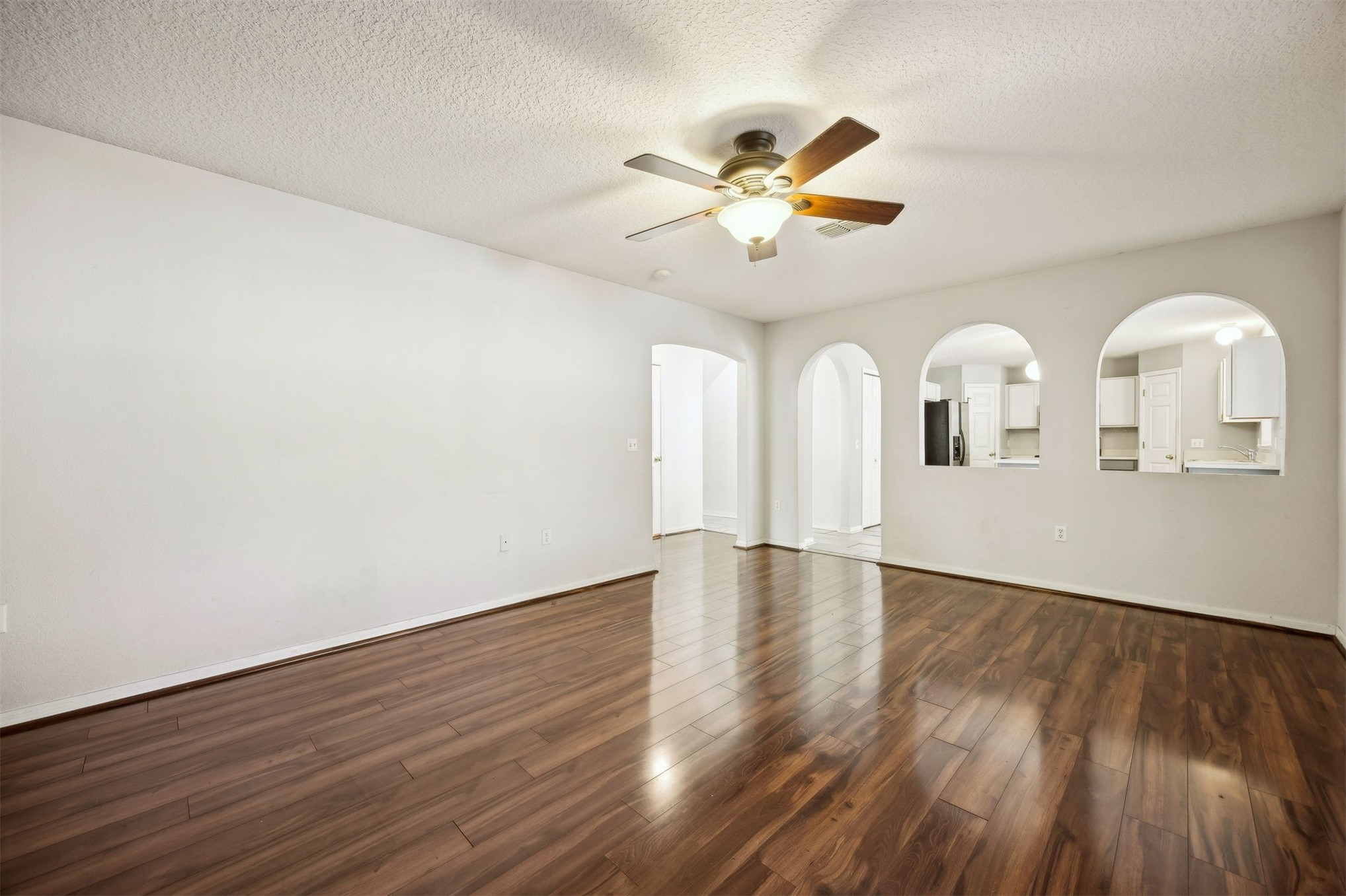 87233 Kipling Drive Yulee, FL 32097 - Photo 5 of 38 a view of a room with wooden floor and ceiling fan