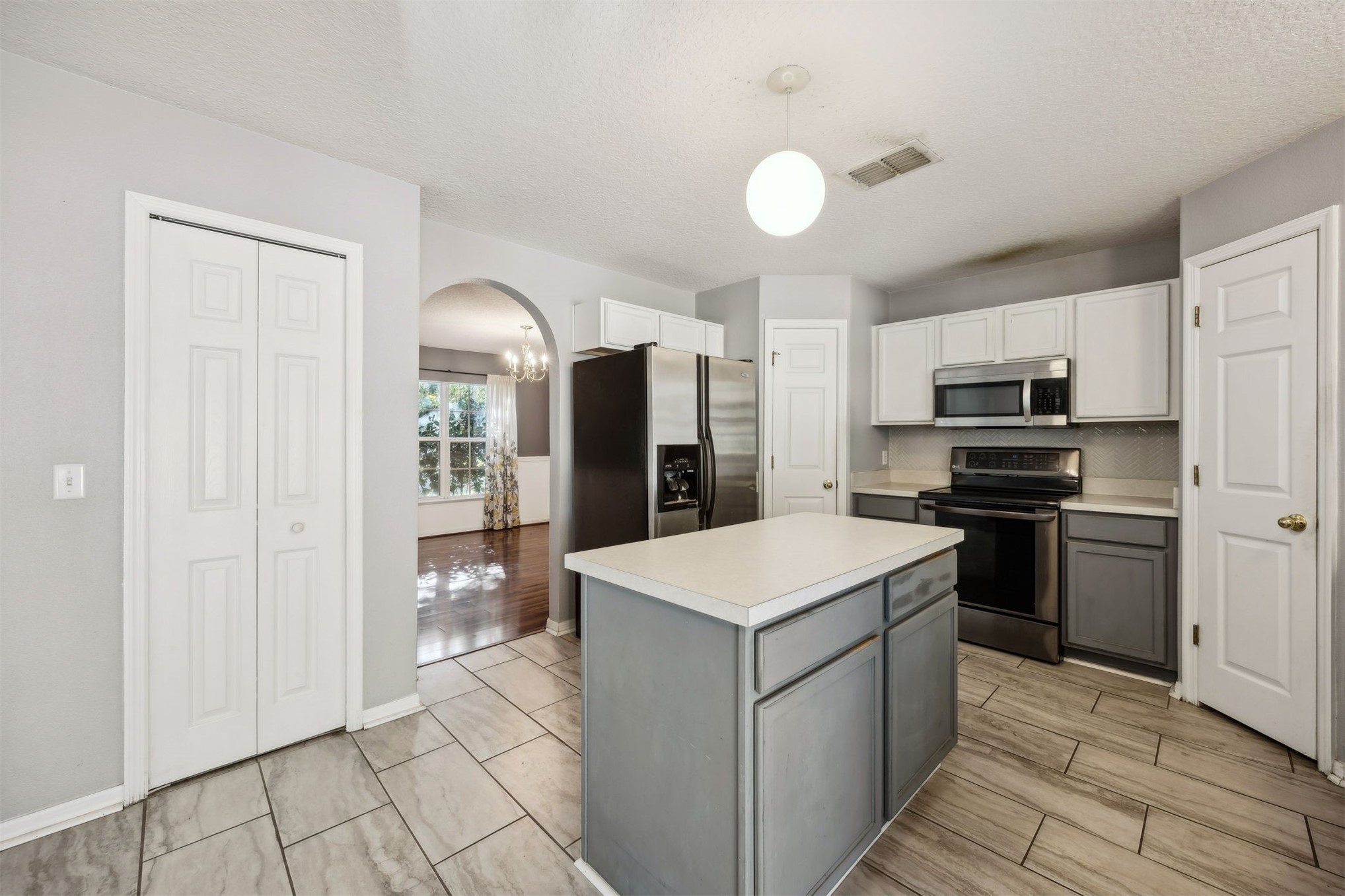 87233 Kipling Drive Yulee, FL 32097 - Photo 8 of 38 a kitchen that has a sink stainless steel appliances a counter space and cabinets