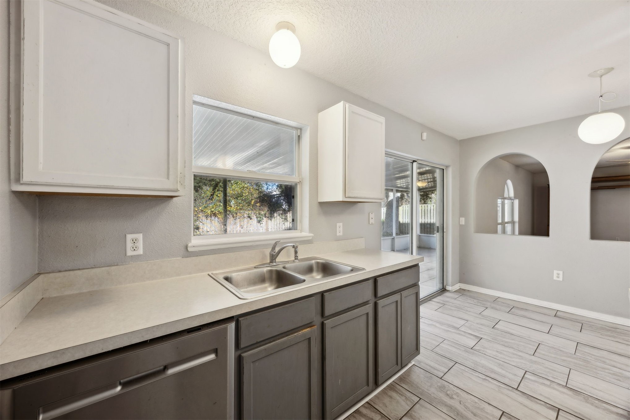 87233 Kipling Drive Yulee, FL 32097 - Photo 10 of 38 a kitchen with a sink and cabinets
