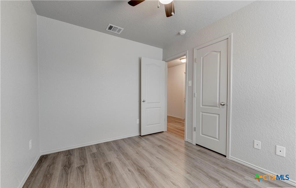 601 Lost Trail, Unit B Copperas Cove, TX 76522 - Photo 21 of 27 a view of an empty room with wooden floor