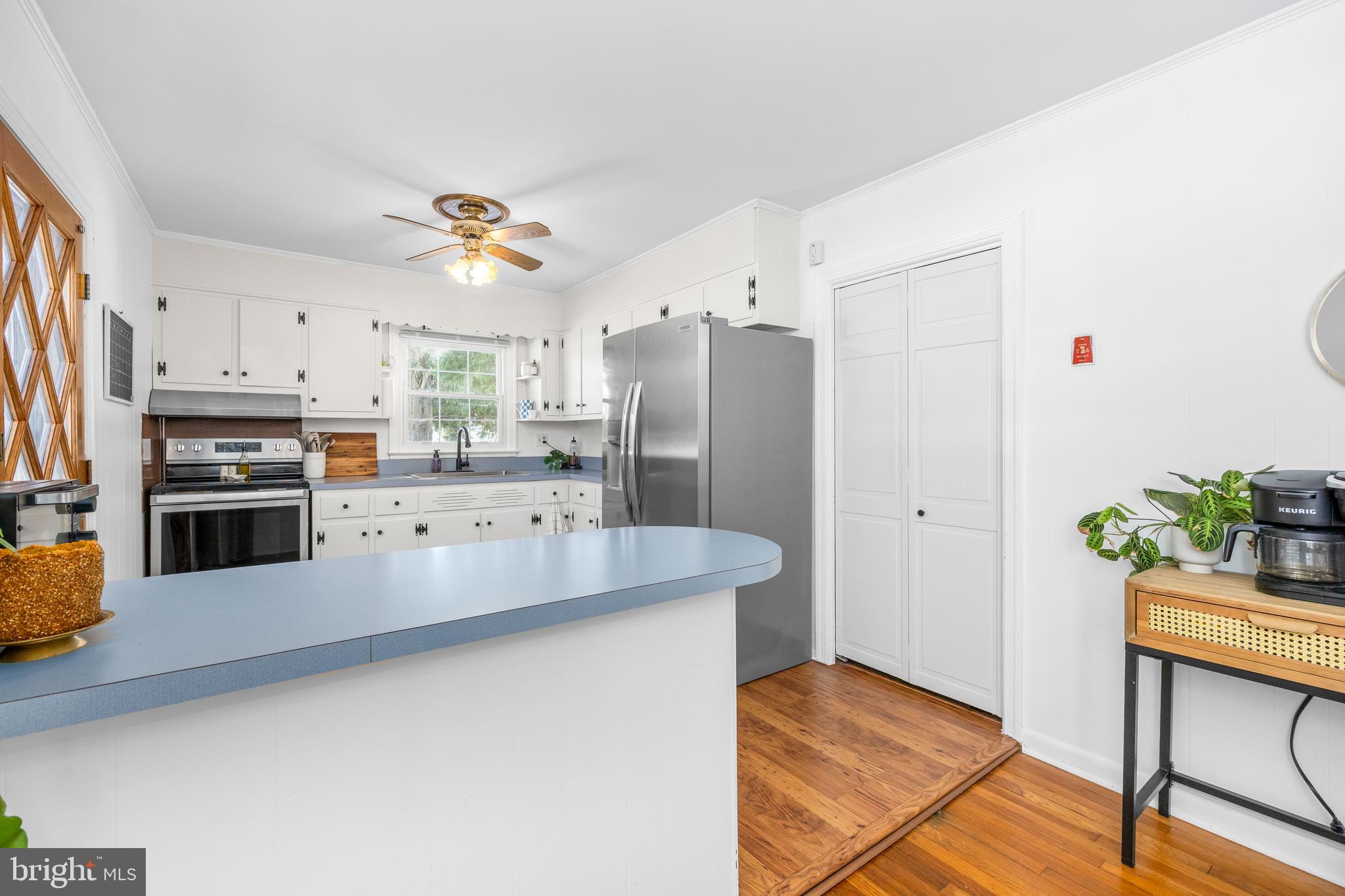 3750 Sunnyside Road East New Market, MD 21631 - Photo 11 of 45 a kitchen with stainless steel appliances a stove a refrigerator and a refrigerator