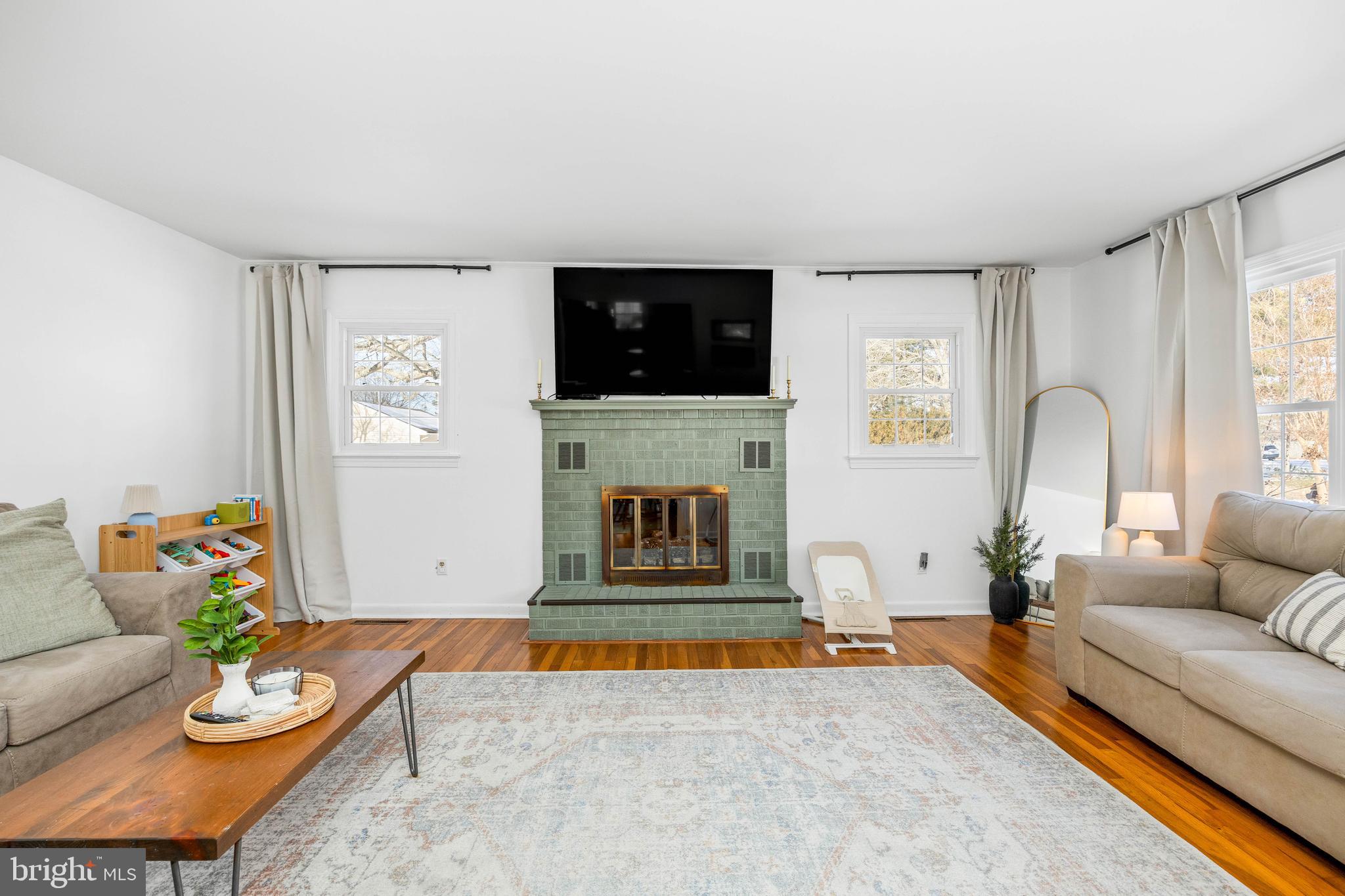 3750 Sunnyside Road East New Market, MD 21631 - Photo 15 of 45 a living room with furniture a fireplace and a flat screen tv