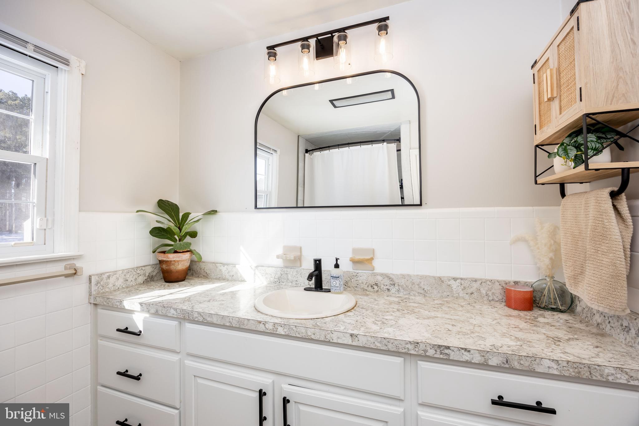 3750 Sunnyside Road East New Market, MD 21631 - Photo 23 of 45 a bathroom with sink and mirror