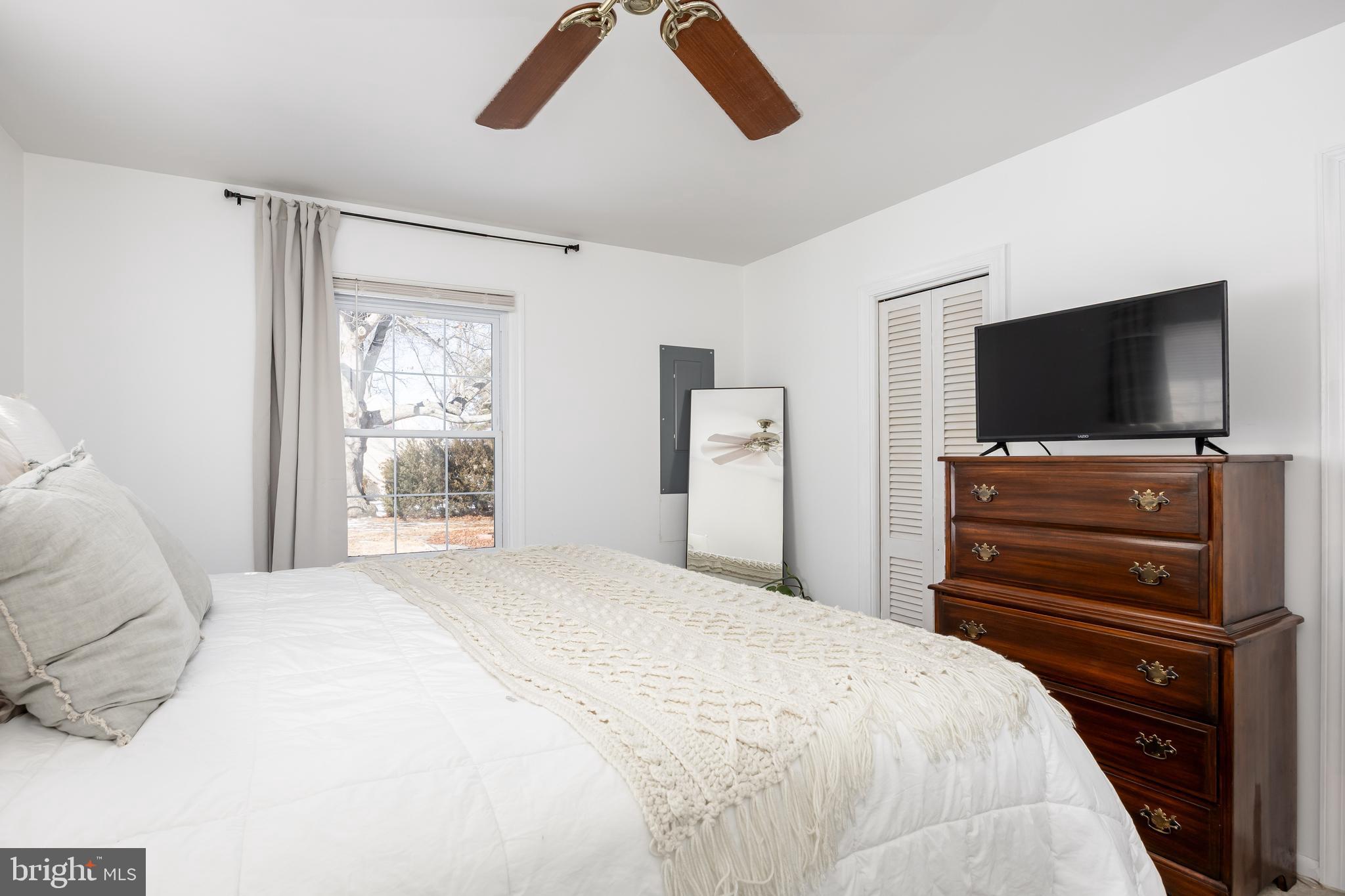3750 Sunnyside Road East New Market, MD 21631 - Photo 32 of 45 a bedroom with a bed and a flat screen tv