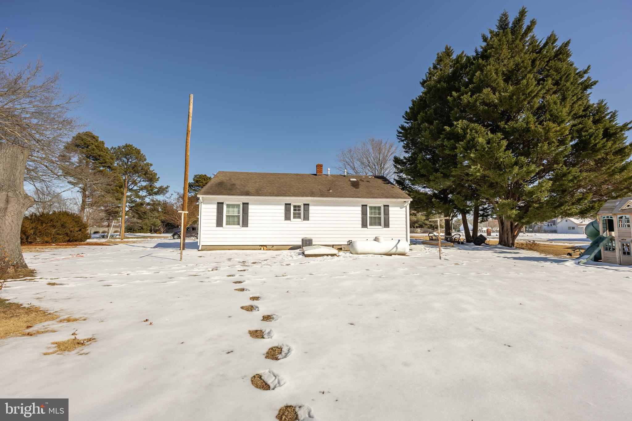 3750 Sunnyside Road East New Market, MD 21631 - Photo 39 of 45 a front view of a house with a yard covered in snow