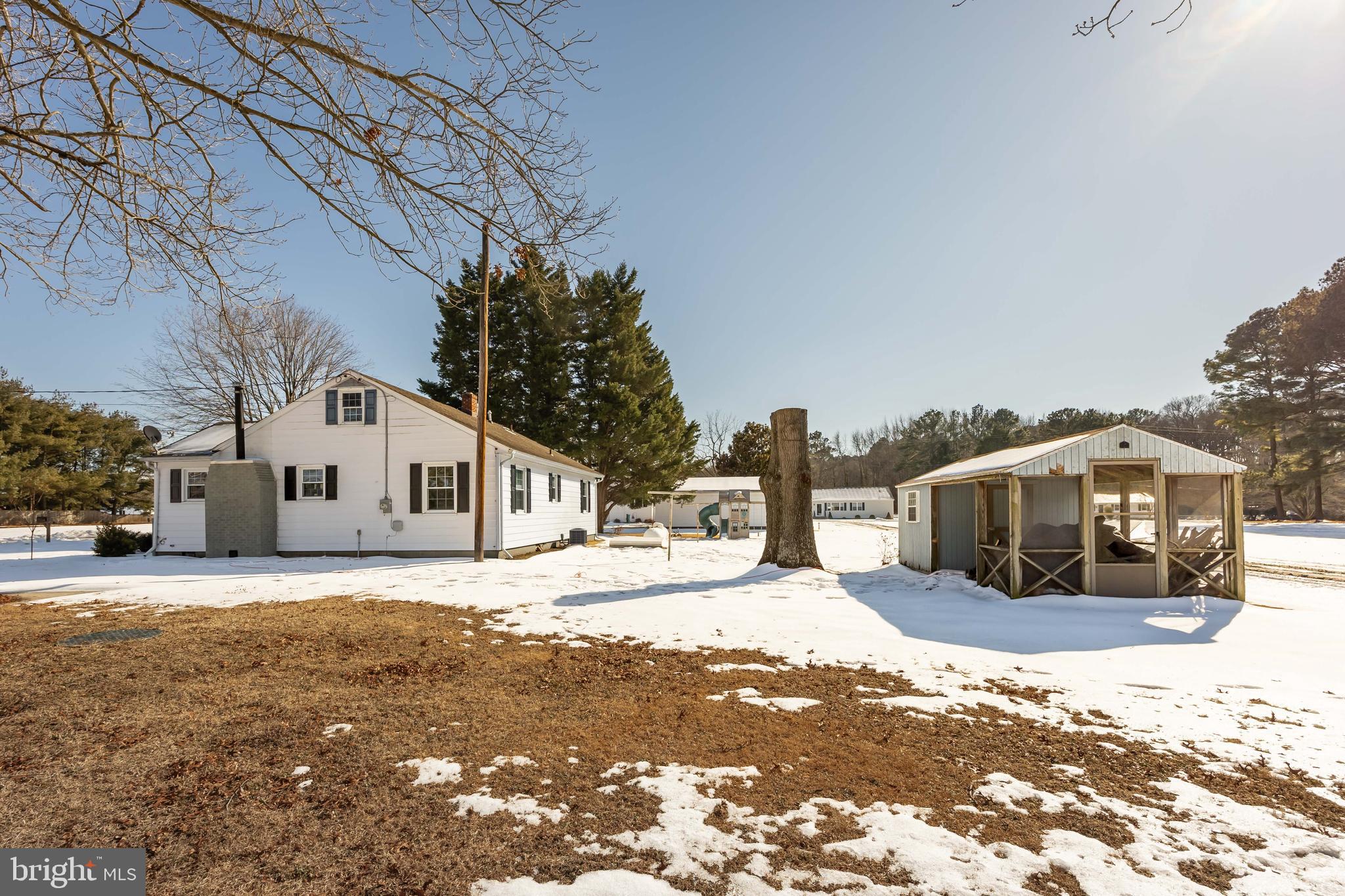 3750 Sunnyside Road East New Market, MD 21631 - Photo 43 of 45 a front view of a house with a yard covered in snow