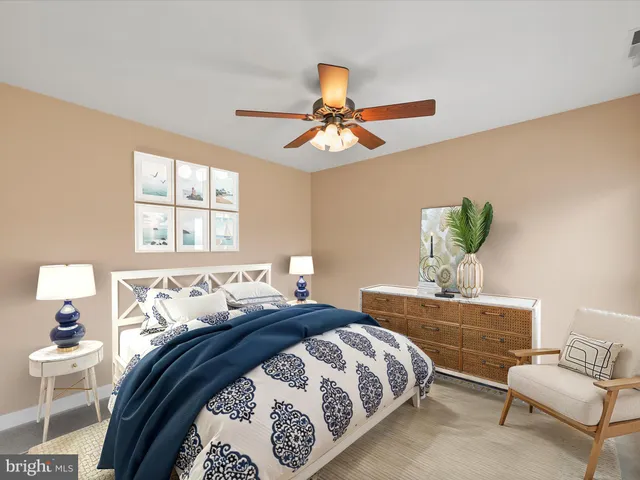 a living room with furniture and large window