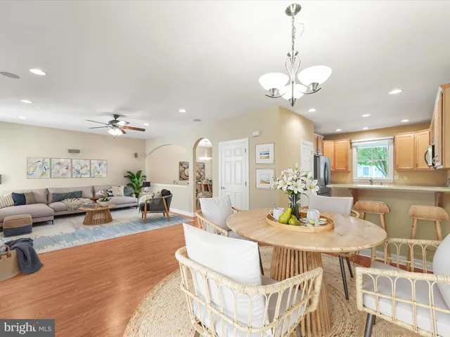 a bedroom with a bed and ceiling fan