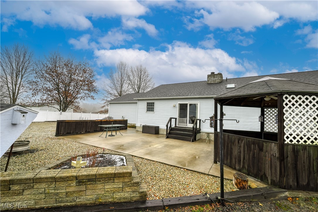 893 Industry Road Atwater, OH 44201 - Photo 40 of 50 Back of property with a gazebo and a patio area