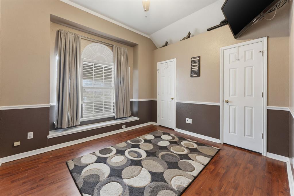 706 Sycamore Creek Road Allen, TX 75002 - Photo 17 of 28 a view of an empty room with window and wooden floor