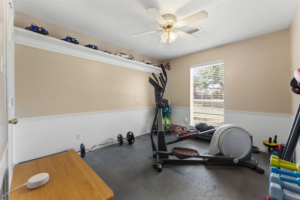 706 Sycamore Creek Road Allen, TX 75002 - Photo 19 of 28 a view of a room with gym equipment