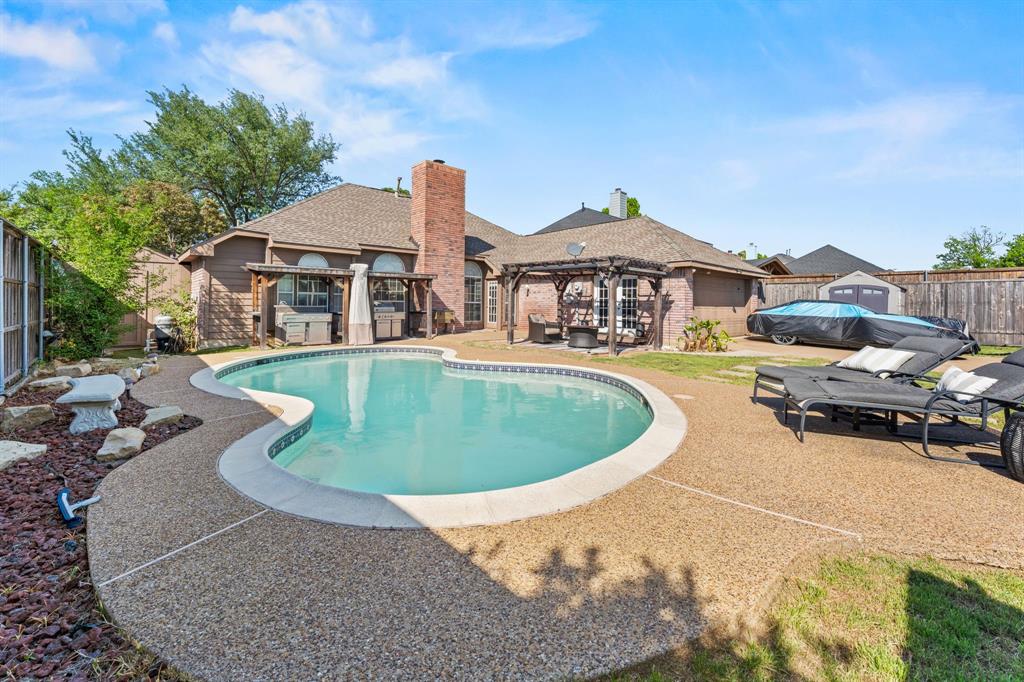 706 Sycamore Creek Road Allen, TX 75002 - Photo 23 of 28 a view of a house with swimming pool and sitting area