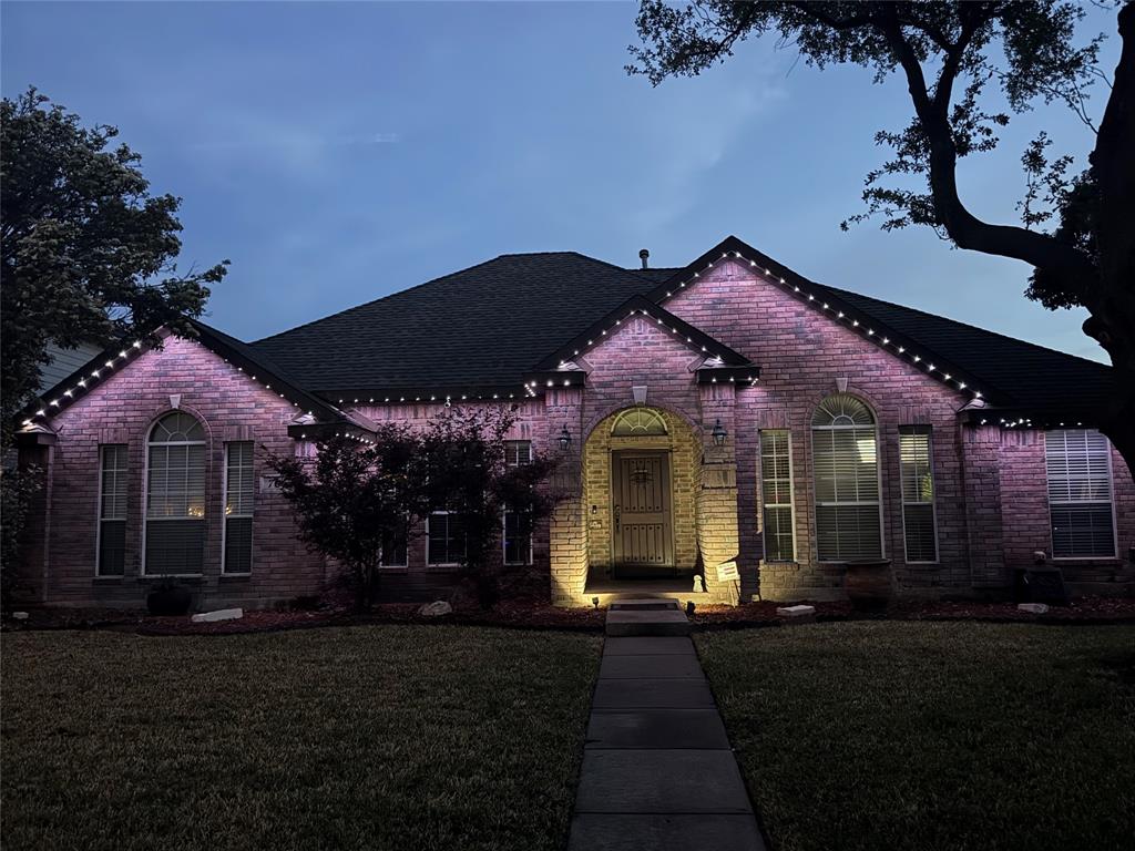 706 Sycamore Creek Road Allen, TX 75002 - Photo 26 of 28 a front view of a house with a garden
