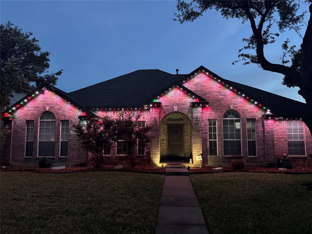 706 Sycamore Creek Road Allen, TX 75002 - Photo 27 of 28 a front view of a house with a garden