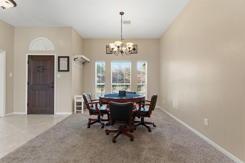 706 Sycamore Creek Road Allen, TX 75002 - Photo 4 of 28 a view of a dining room with furniture window and outside view