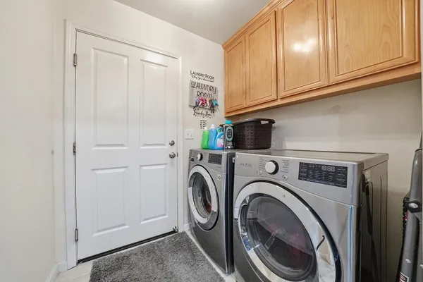a utility room with dryer and washer