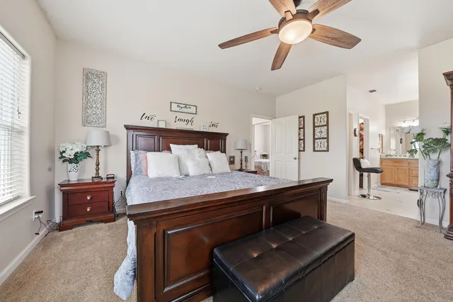 a bedroom with a bed and window