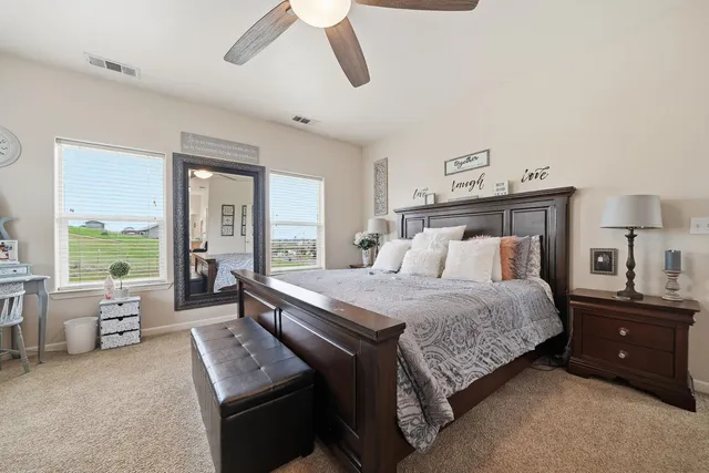 a bedroom with a bed and a couch