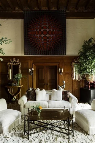 a living room with furniture and lamp