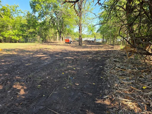 a backyard of a house with lots of green space and fog