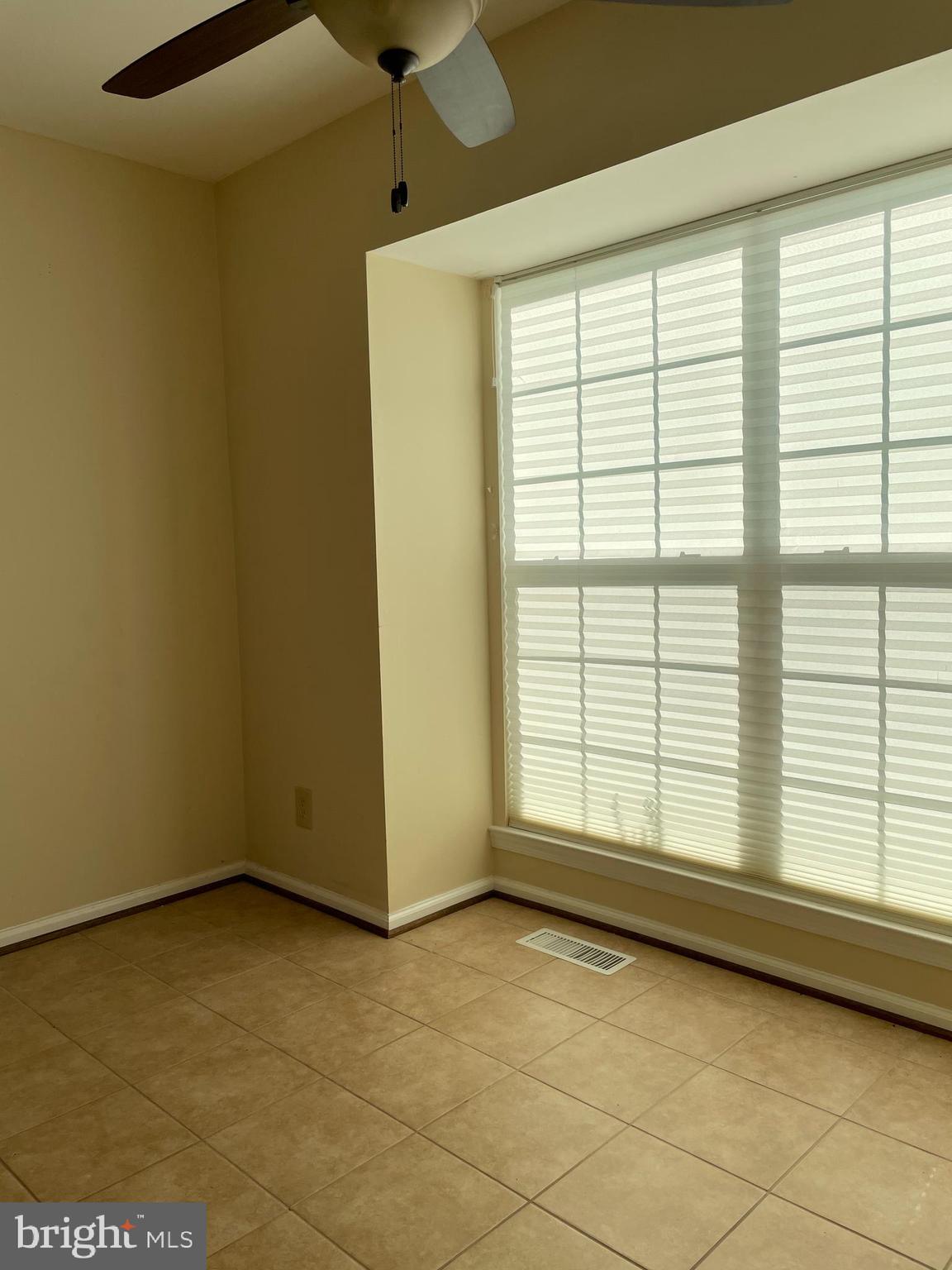 12405 Gooderham Way Gaithersburg, MD 20878 - Photo 8 of 31 a view of an empty room with a window