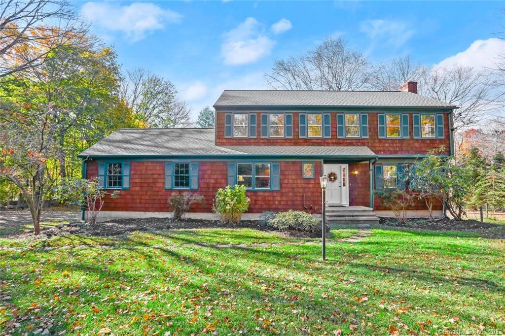 743 Ridgefield Road Wilton, CT 06897 - Photo 1 of 1 a front view of a house with a yard