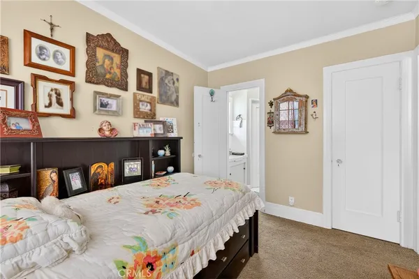 a bedroom with a bed and dresser