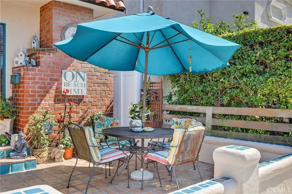 a patio with a patio table and chairs