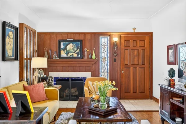 a living room with furniture fireplace and flat screen tv